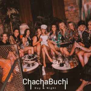 A large hen party group sat in a private booth with bottles of spirit and mixers on the table. in chachabuchi newcastle.