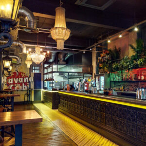 The vibrant bar counter in Castro's Newcastle, in the background a havana club sign,